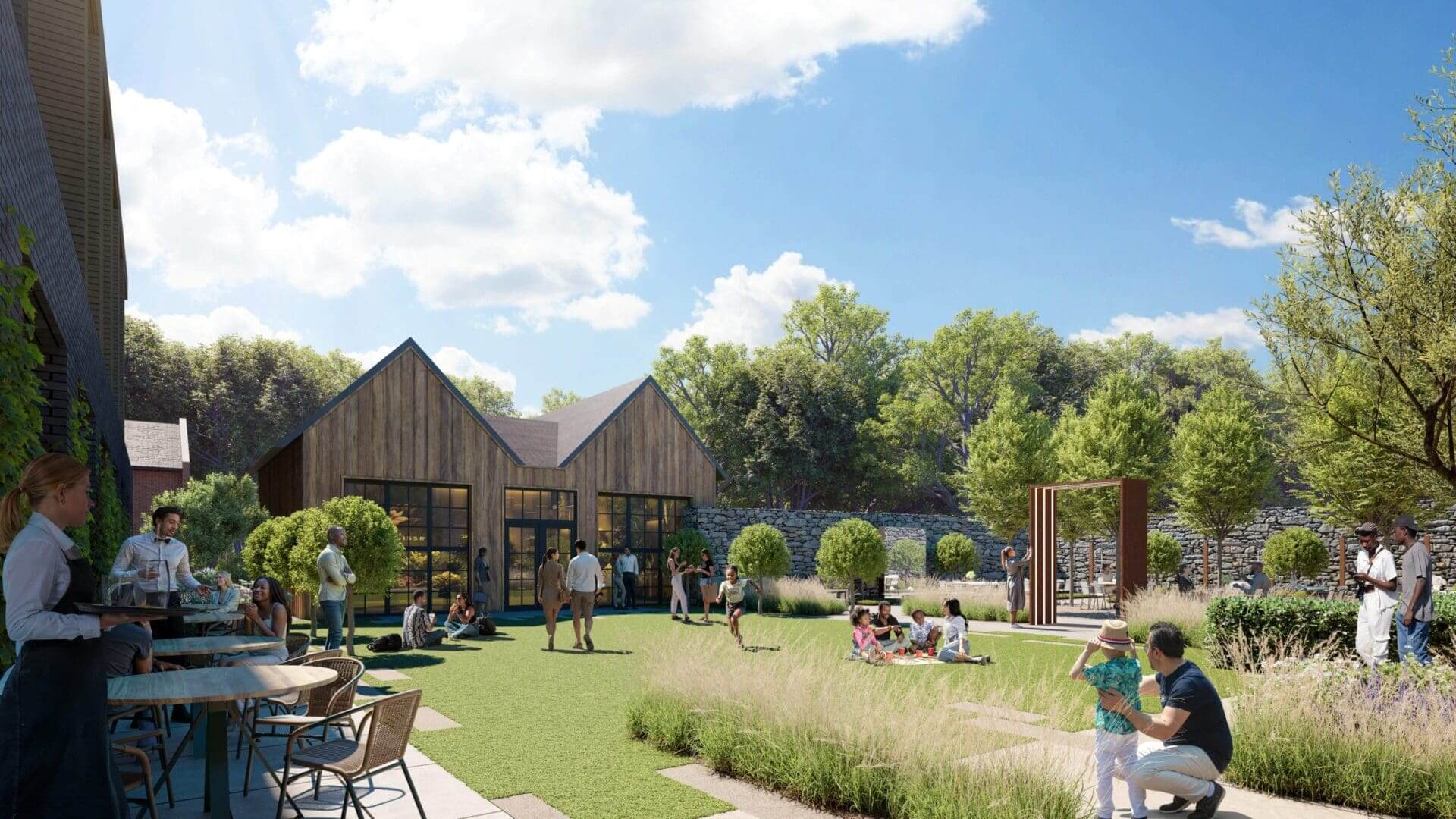 Outdoor gathering in a sunny garden setting.