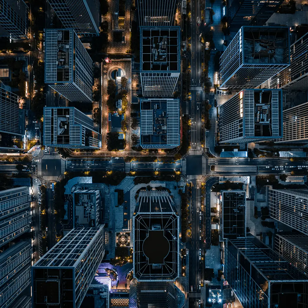 Top-down night view of downtown city intersection
