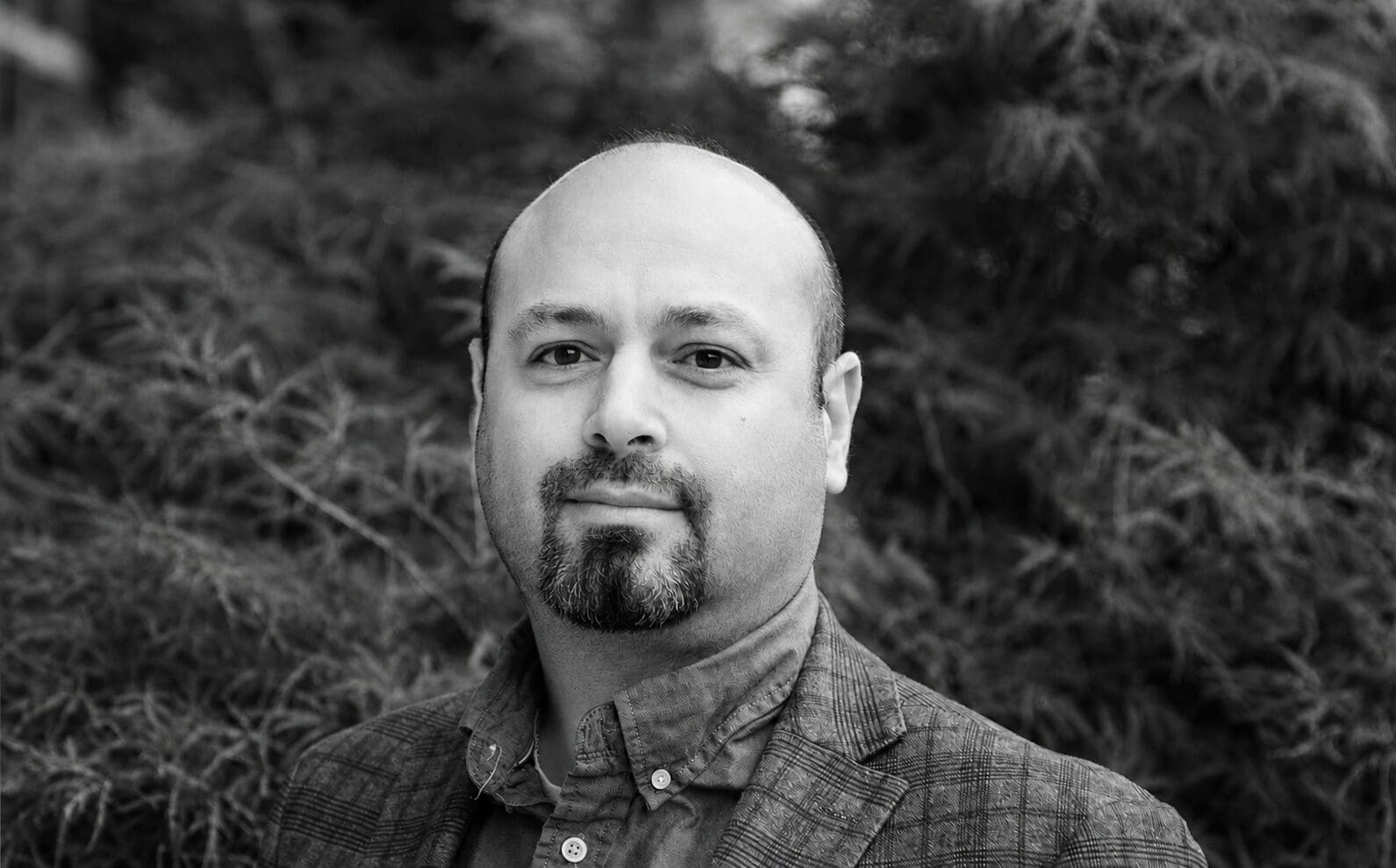 Black and white portrait of bald man